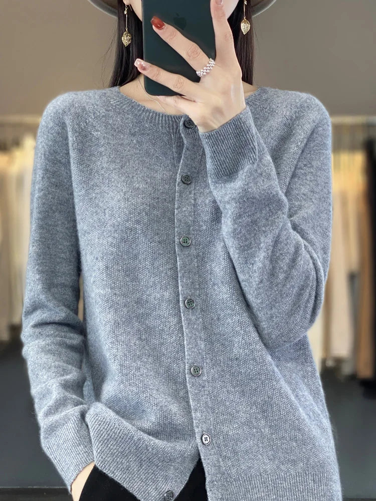 Elegant women's knit cardigan with button-front closure. Versatile long-sleeve layering piece.
