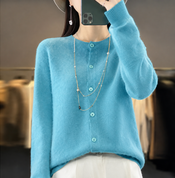 Woman wearing an elegant button-front knit cardigan, showing its comfortable & chic fit.