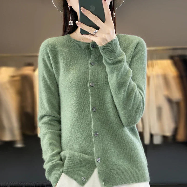 Back view of a women's elegant knit cardigan, highlighting its versatile long-sleeve design.