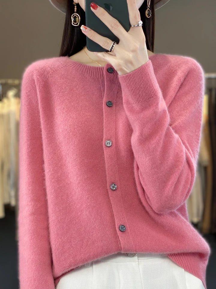 Folded elegant women's knit cardigan, emphasizing the soft knit and button-front detail.