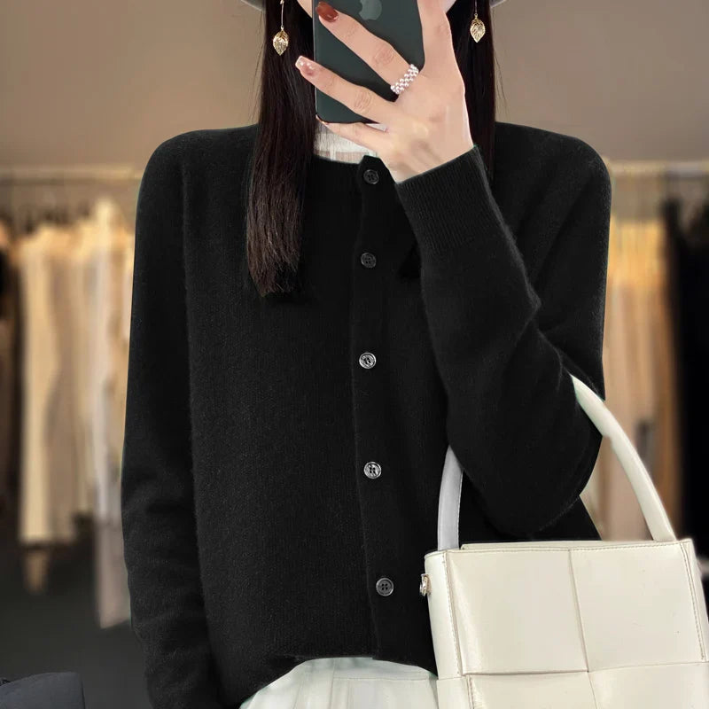 Cream elegant women's button-front knit cardigan. Comfortable & versatile long-sleeve knitwear.