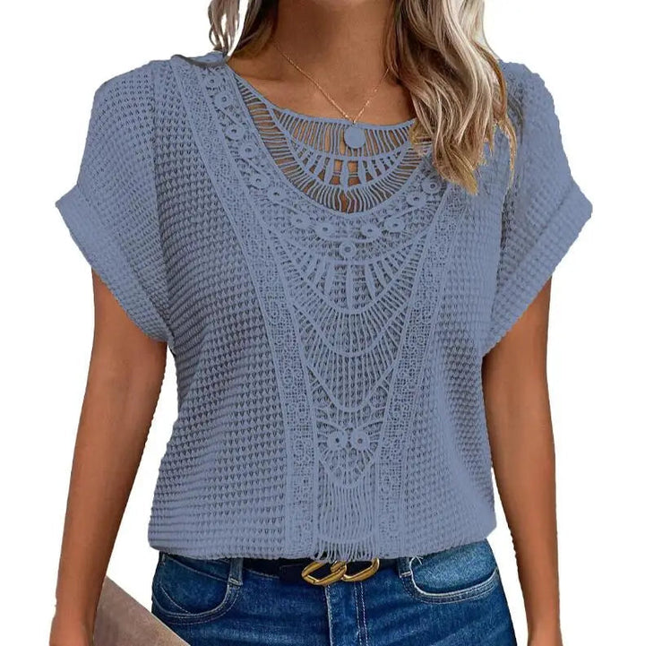 Women's elegant lace top, perfect for going out. Chic detail & comfortable design for versatile wear.