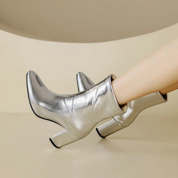 Comfortable women's silver ankle boots with a modern, elegant design. Stylish & versatile footwear for everyday casual to formal wear.