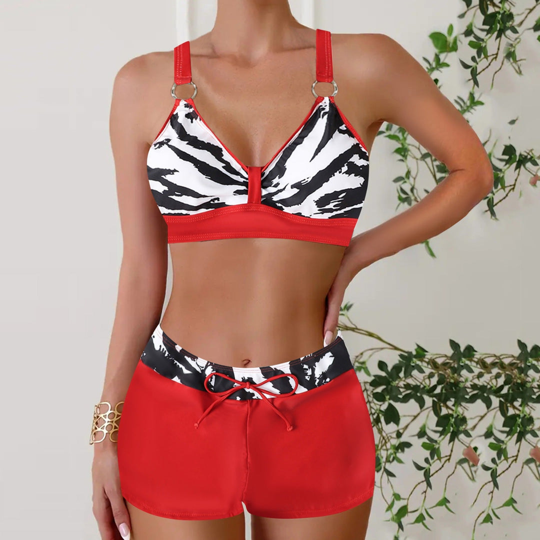 Women's fashionable two-piece bathing suit with nautical stripes, great for beach days.