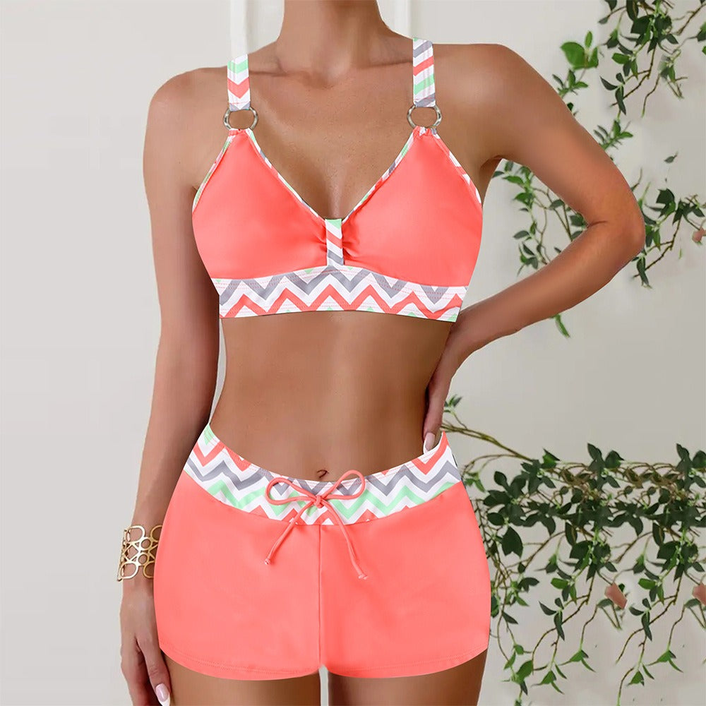 Stylish women's two-piece swimsuit with nautical stripes for coastal summer fun.