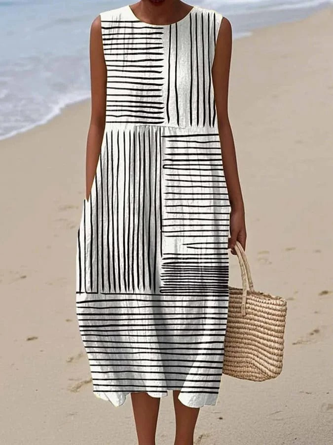 Elegant black flowy midi dress for women, versatile day-to-night style with an adjustable waist, perfect for summer.