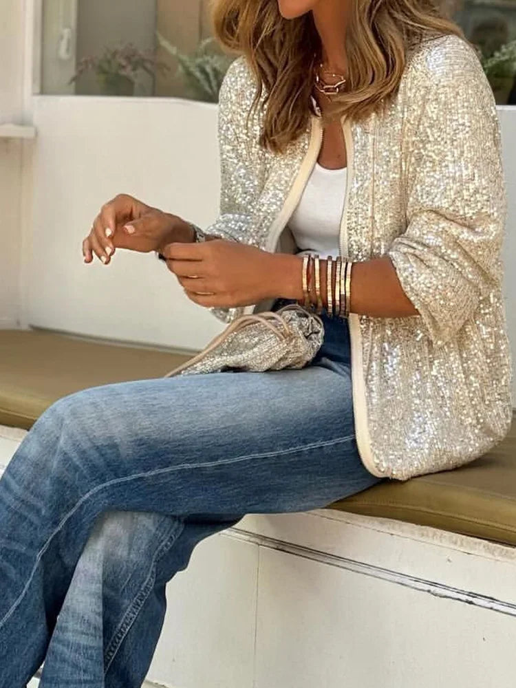 Glamorous women's sequin jacket with front zip. Shimmering outerwear, perfect for dazzling party or loungewear.