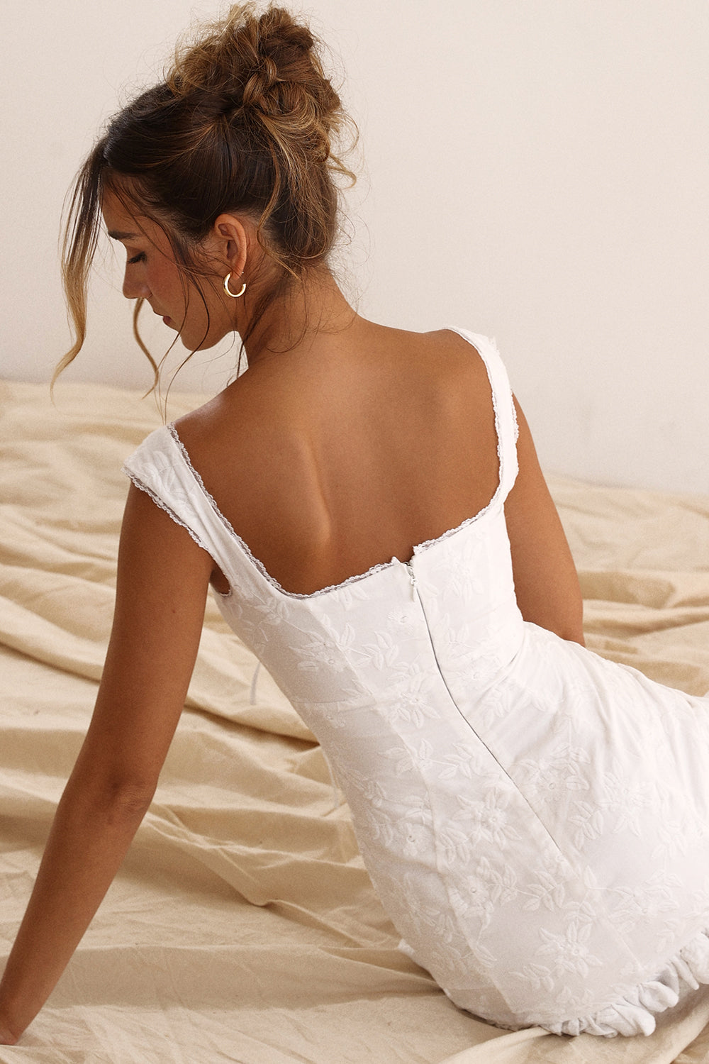 Stylish women's white mini party dress with a tie waist, great for summer events & casual outings.