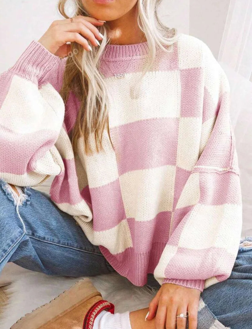 Elegant oversized checkerboard sweater for women, a cozy and fashionable knit top.
