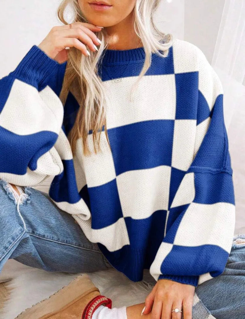 Stylish women's cozy knit sweater with a classic checkerboard design, ideal for casual outfits.