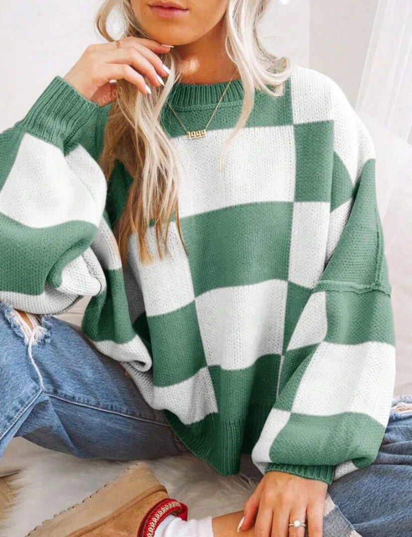 Comfortable oversized checkerboard sweater for women, knitted for ultimate fall and winter coziness.