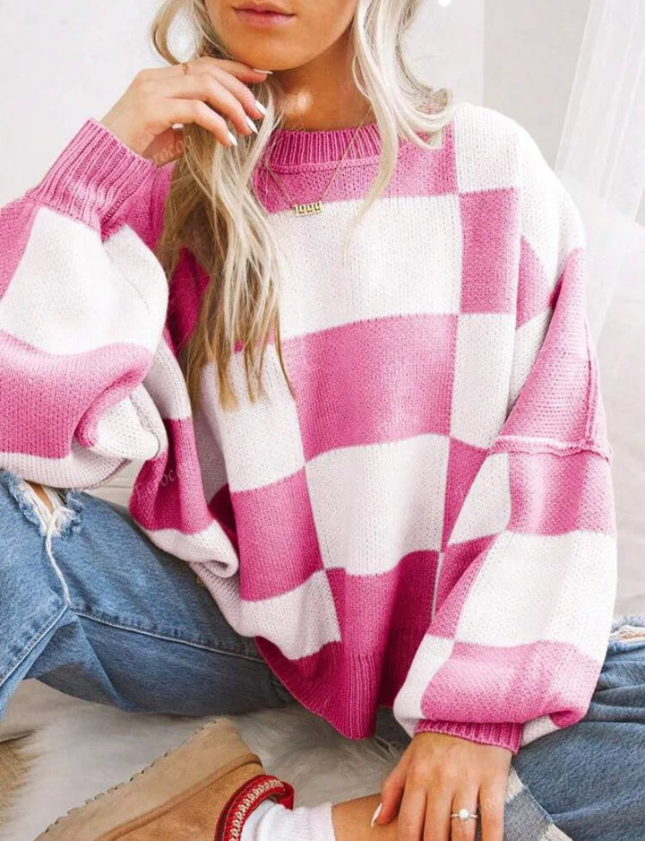 Trendy women's fall fashion: Oversized checkerboard knitted sweater, comfortable and chic.