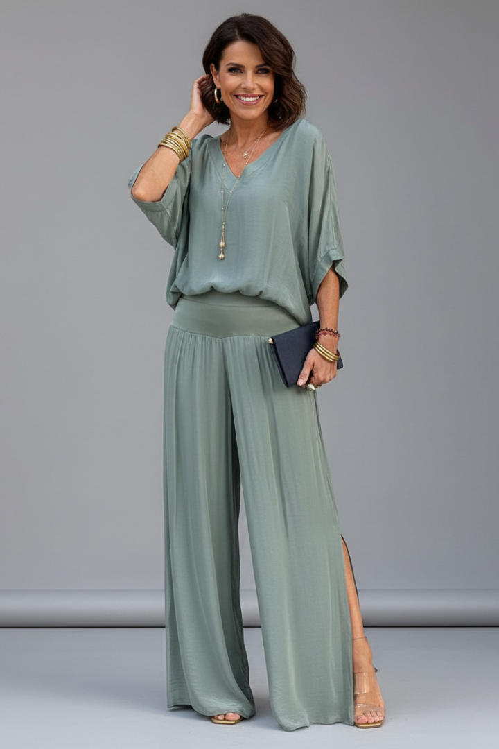 Elegant women's two piece outfit: a flowy chiffon top and matching wide leg pants.