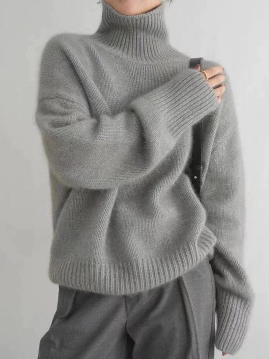Warm women's knit turtleneck sweater for winter, ideal for chilly weather & casual everyday style.