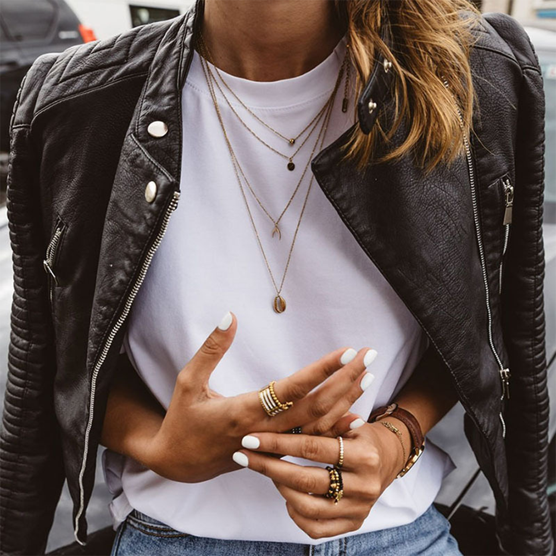 Edgy women's biker jacket in a sleek design with bold zip details, offering a contemporary and stylish outerwear option.