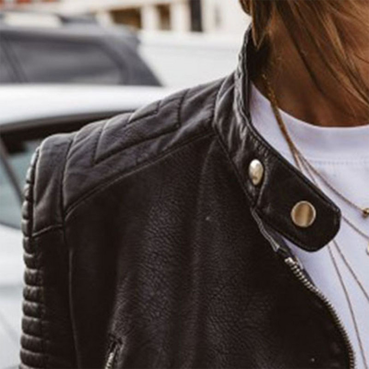 Versatile women's edgy biker jacket with intricate zip accents and a tailored fit, a key piece for fashion-forward looks.