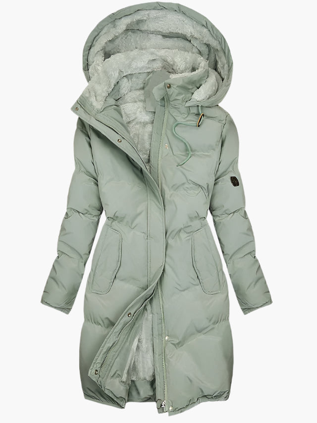 Stylish women's long quilted winter coat with hood. Perfect warm outerwear for cold weather fashion.