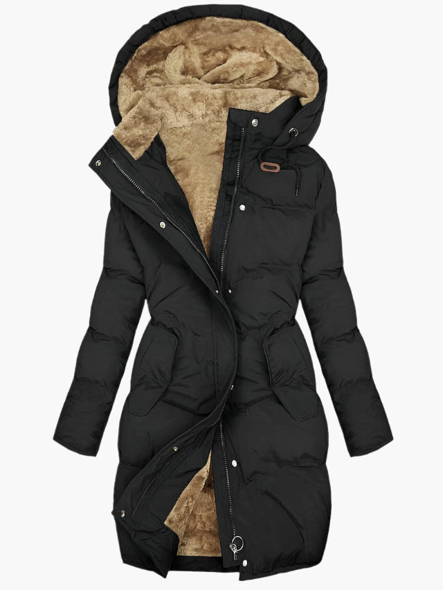 Warm women's long hooded quilted jacket. Ideal casual outerwear for cold winter days, offering comfort.