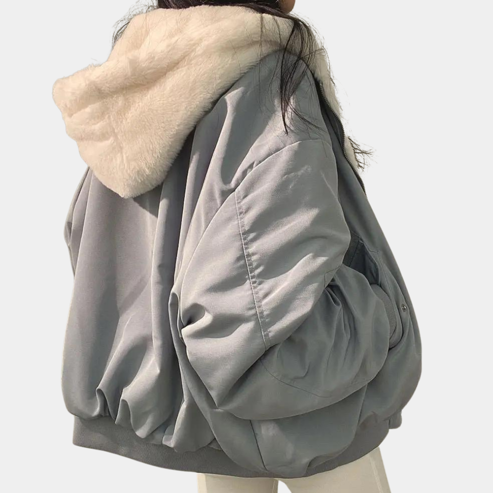 Fashionable women's oversized long hooded winter coat, providing warmth and style for ultimate cold weather protection.
