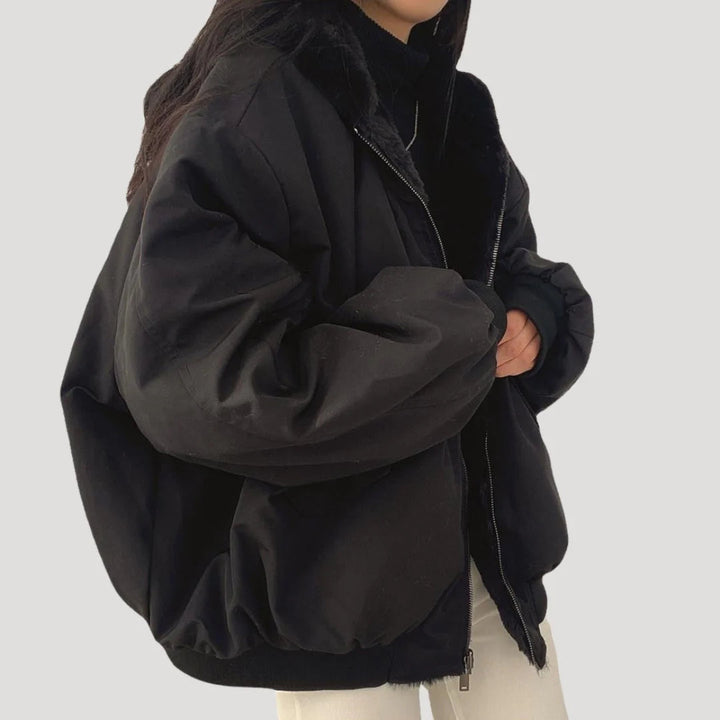 Oversized hooded long winter coat for women, offering cozy warmth and a modern, elegant look for cold weather.