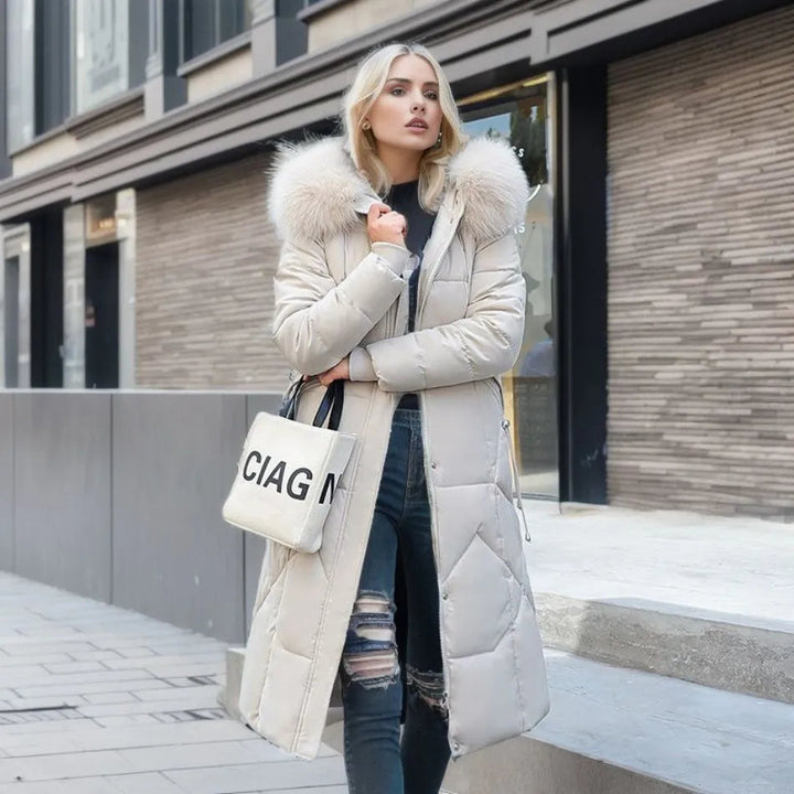 Women's quilted hooded winter coat, warm & stylish. Perfect for cold weather fashion.