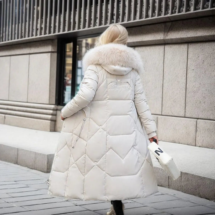 Model wearing a women's stylish quilted hooded winter coat, front view, perfect for daily wear.
