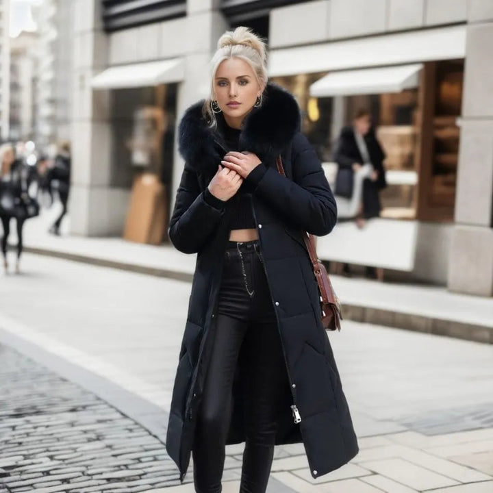 Back view of a women's warm quilted winter coat with hood, elegant & functional outerwear.