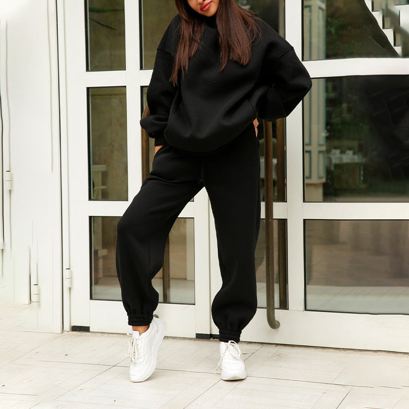 Relaxed fit women's athleisure loungewear set, featuring a comfortable hoodie & matching elastic waist sweatpants.