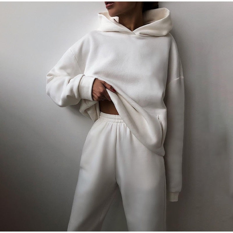 Detail shot of the soft fabric on a women's relaxed fit loungewear set, featuring a cozy hoodie and sweatpants.