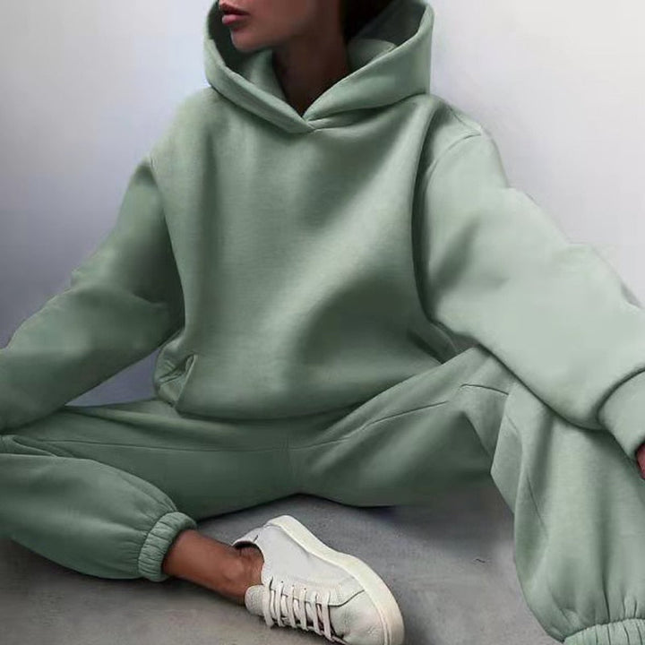 Women's relaxed fit hoodie and soft sweatpants, sold as a matching loungewear set for everyday comfort.