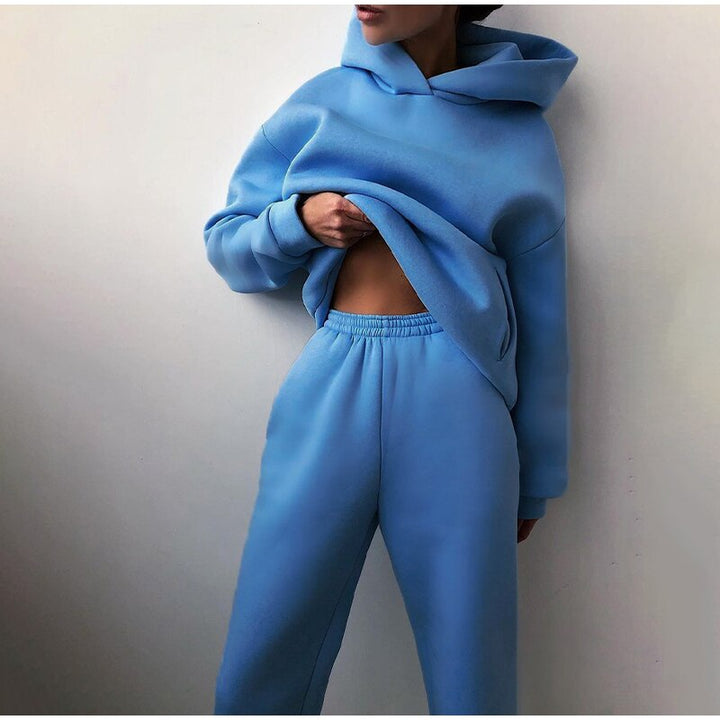 Women's relaxed fit loungewear set: hoodie with drawstring & elastic waist sweatpants with cuffed hems.