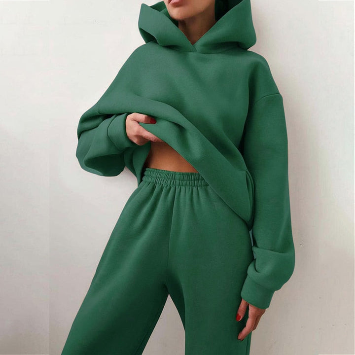 Woman wearing a relaxed fit loungewear set: a cozy hoodie & soft sweatpants, perfect for home or casual errands.