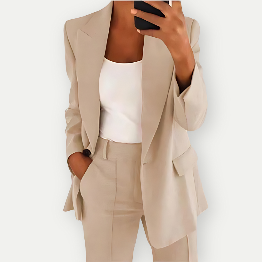 Chic women's blazer & trouser suit set, perfect for professional office wear. Tailored for business casual.