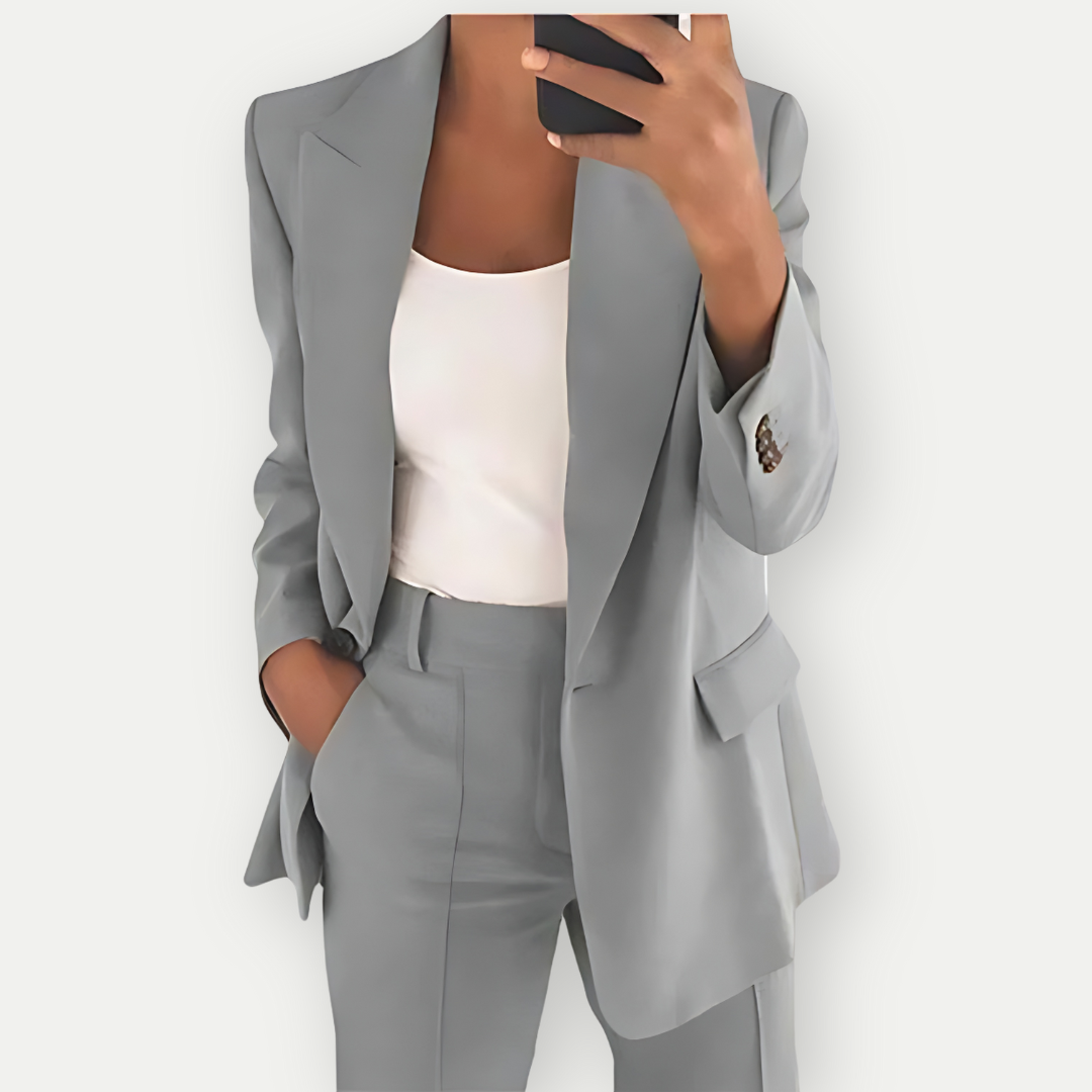 Professional women's suit set: tailored blazer and trousers for business casual meetings or elegant events.