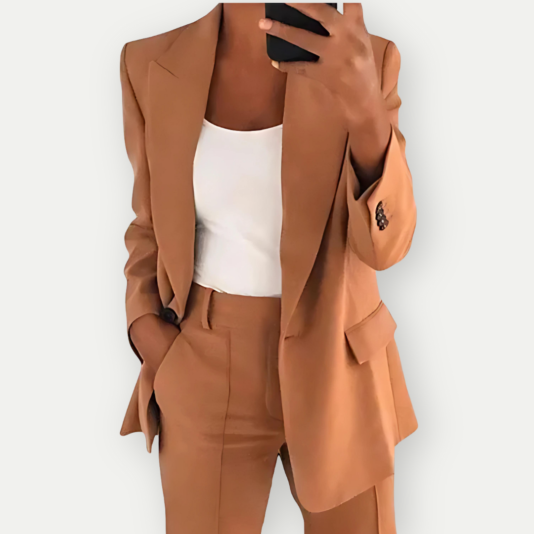 Modern women's navy blue blazer & trouser suit set, offering a chic and elegant professional office style.