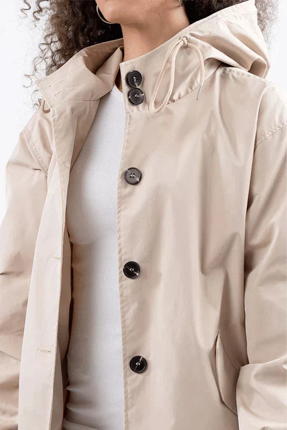 Modern women's waterproof rain jacket, a stylish & practical choice for city fashion, travel, & daily commutes.