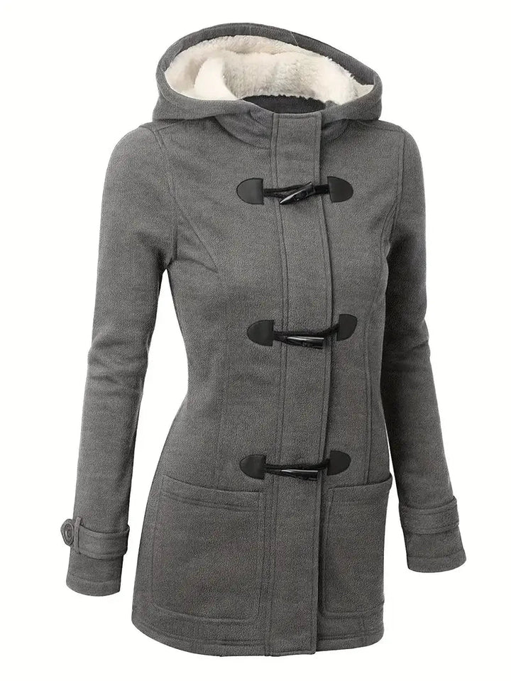 Chic women's green Caroline trench coat, an elegant and stylish outerwear for autumn and fall layering.