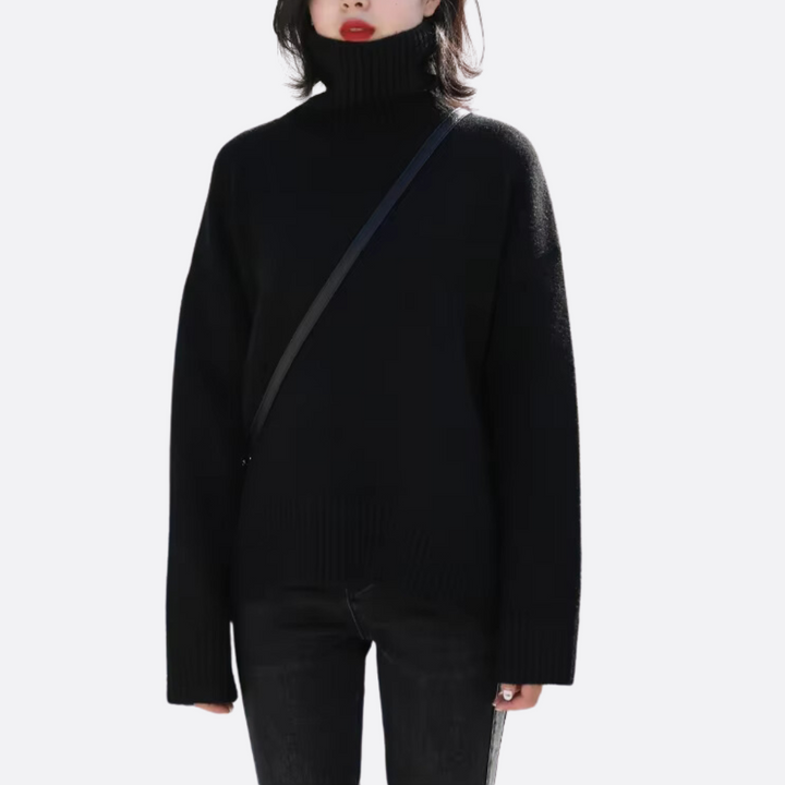 Warm knit oversized turtleneck sweater for women. Cozy long sleeve, relaxed fit, chic fall/winter apparel fashion.
