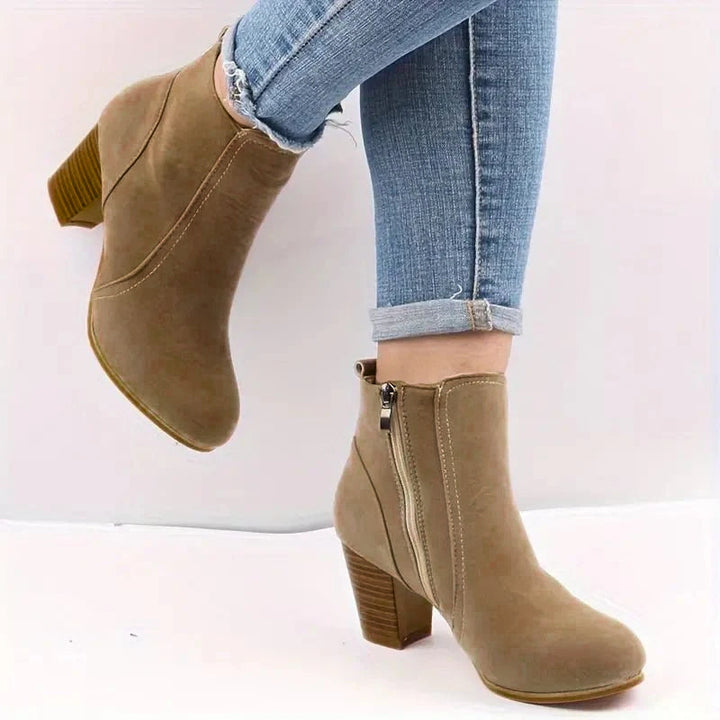 Stylish women's brown ankle boots featuring a comfortable block heel and convenient side zip closure.