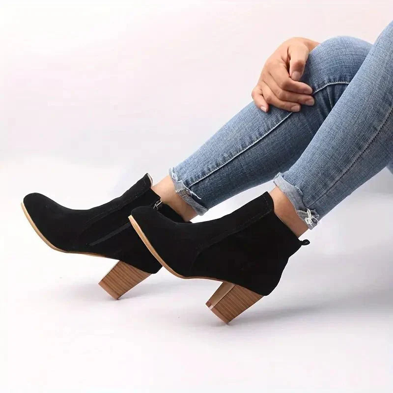 Stylish brown ankle boots for women, showcasing a comfortable block heel and easy-to-use side zip for winter.