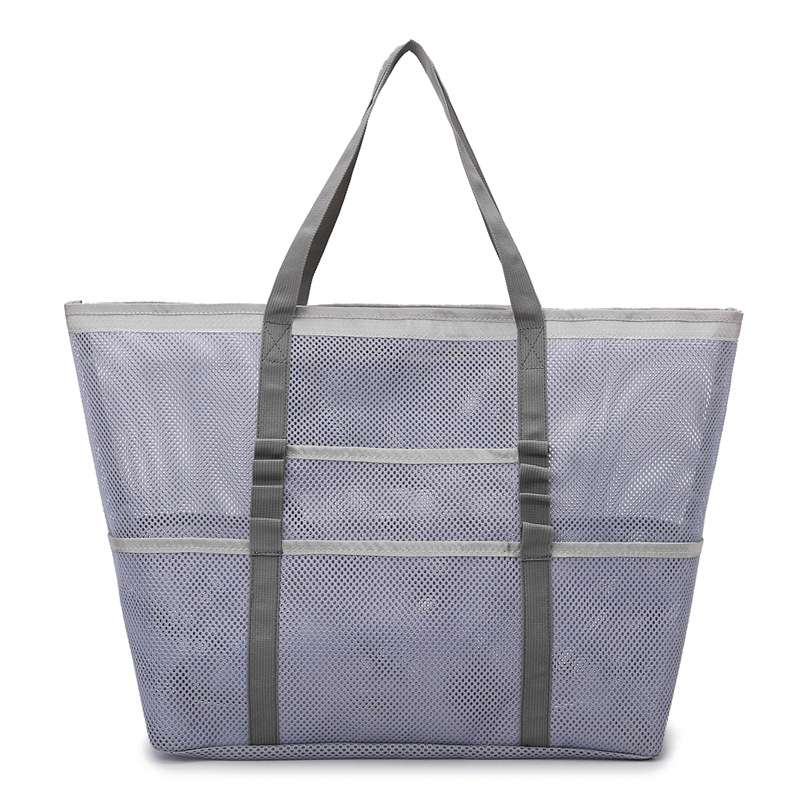 Durable large mesh beach bag, an essential women's summer accessory for sand, sun & fun.