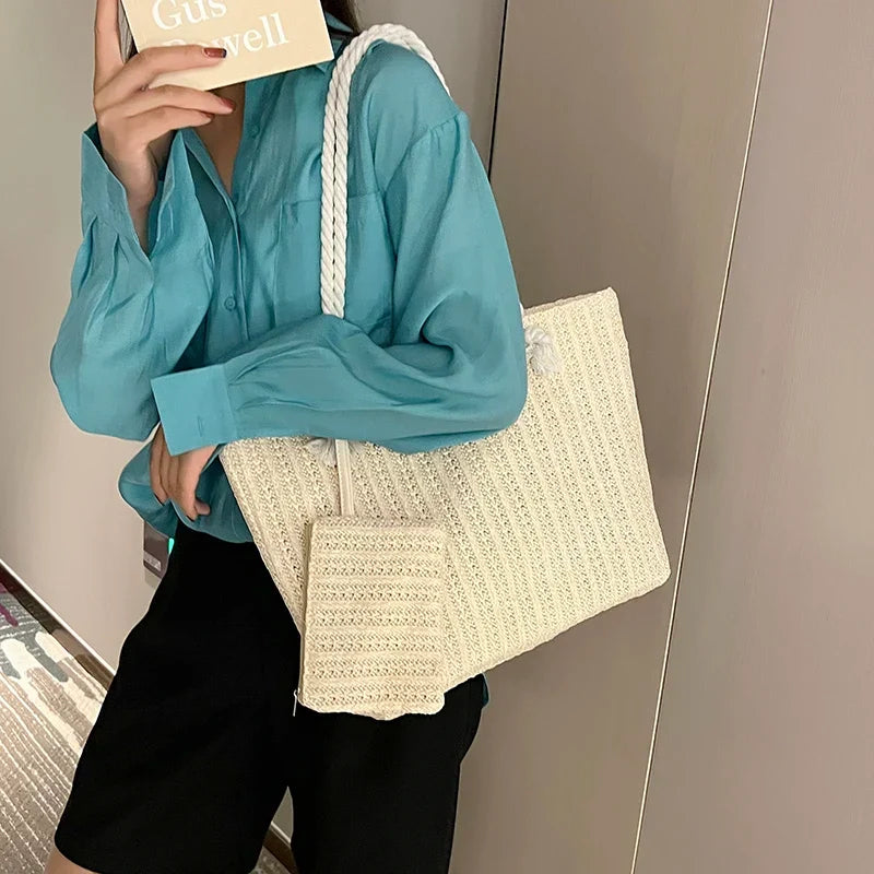 Woven women's beach tote bag with sturdy rope handles, ideal for carrying essentials to the beach or pool. Coastal style.