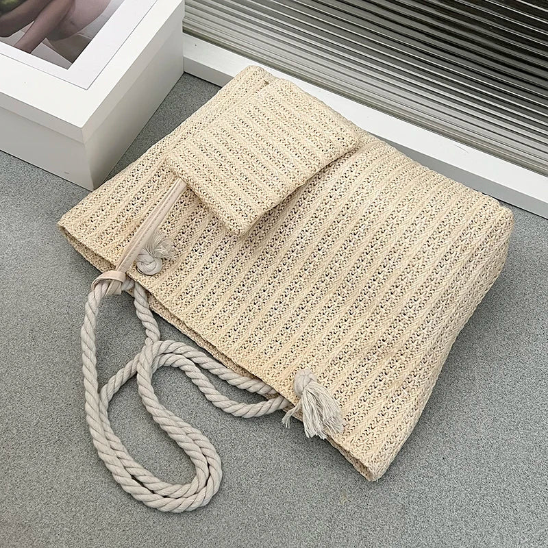 Elegant women's beach tote featuring natural rope handles and a charming woven design, great for coastal adventures.