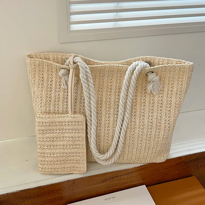 Spacious women's summer beach tote bag, designed with practical rope handles for comfortable carrying. Casual coastal look.