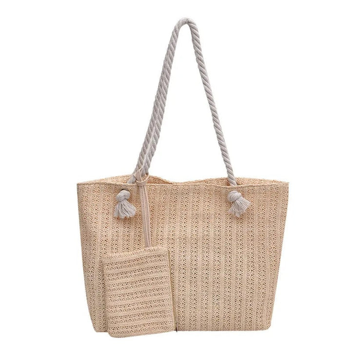 Women's casual coastal style beach tote bag, featuring a durable woven body and fashionable rope handles for summer.