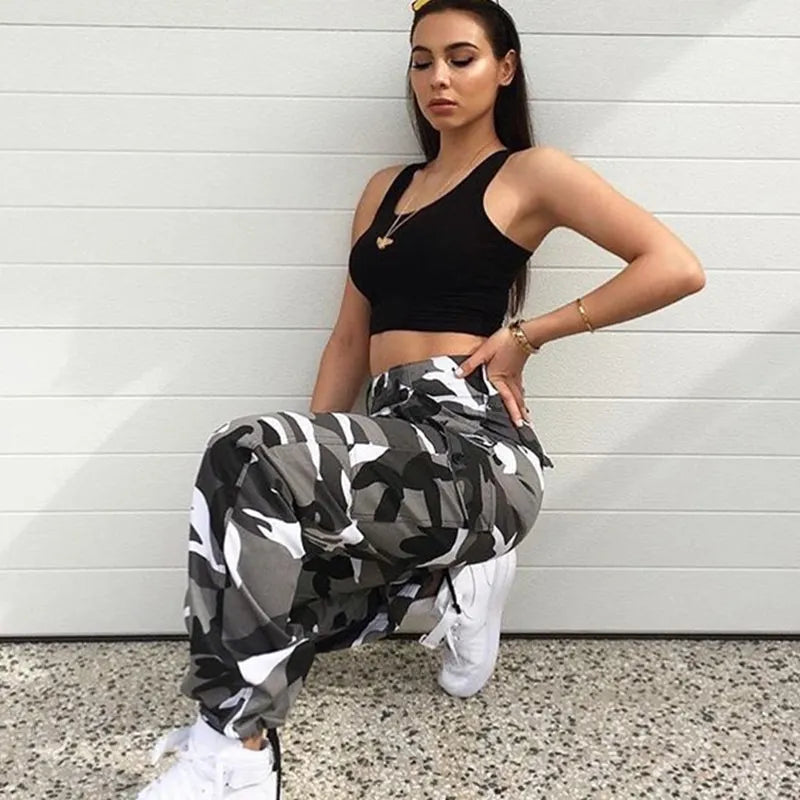 Stylish women's camo cargo pants with a comfortable baggy fit, designed with practical pockets & ankle cuffs.