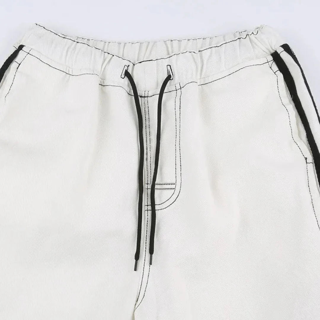 Stylish women's baggy wide leg cargo pants with a bold side stripe and practical utility pockets.