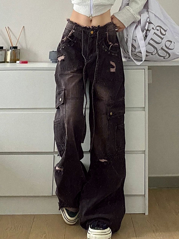Women's black wide leg cargo jeans with distressed rips. Baggy fit, high-rise, perfect for casual street style.