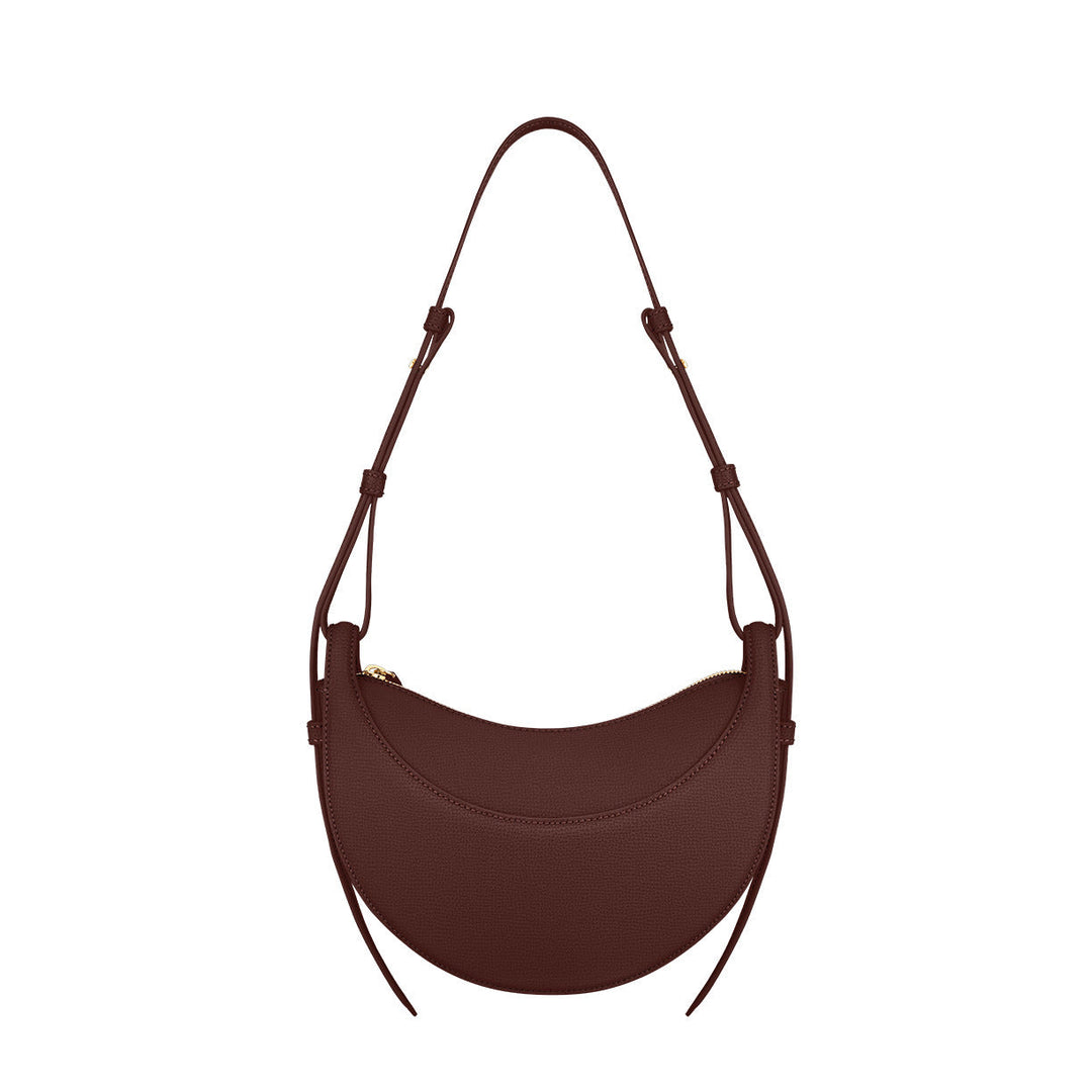 Versatile women's crescent shoulder bag with adjustable strap & zip closure, ideal as an everyday fashion accessory.
