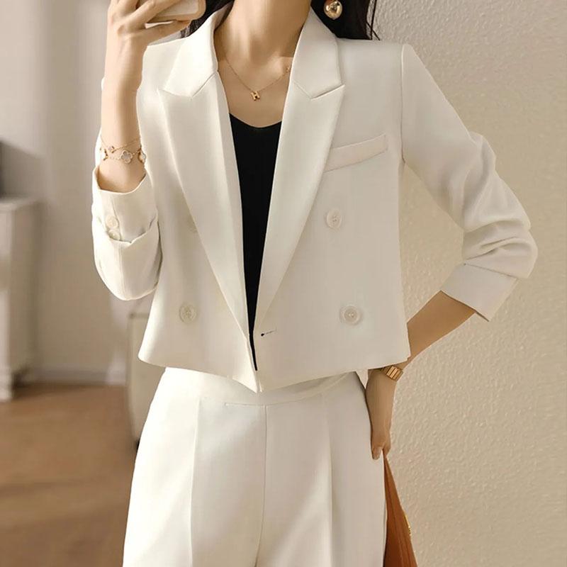 Tailored women's cropped blazer, double-breasted design. Versatile professional jacket for business wear.